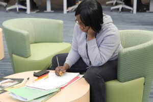 Female student sitting in the library