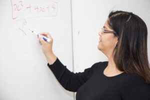 Female student at whiteboard