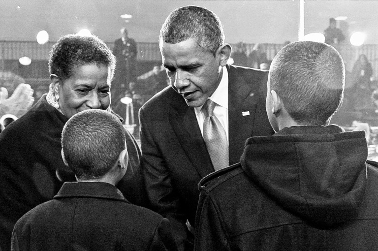 At his second inauguration, President Obama speaks with Nolan Evers, 12, and Alex Evers, 13, about the importance of their grandfather Medgar's work, as their grandmother Myrlie Evers-Williams looks on.