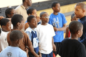 Male coaching young students