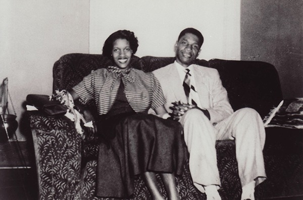 Medgar and Myrlie Evers sitting on a couch