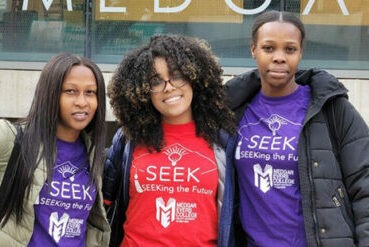 Three female students standing outside