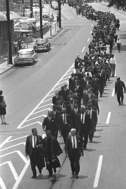 In this June 15, 1963, file photo, mourners march to the Jackson, Miss., funeral home following services for slain civil rights leader Medgar Evers. (AP Photo)