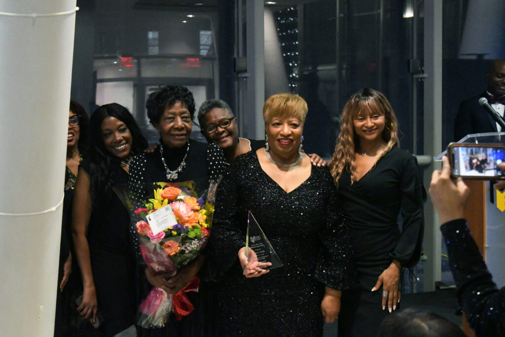 Dr. Patricia Ramsey (second from right) sharing the moment with honoree Katie L. Davis, friends and family.
