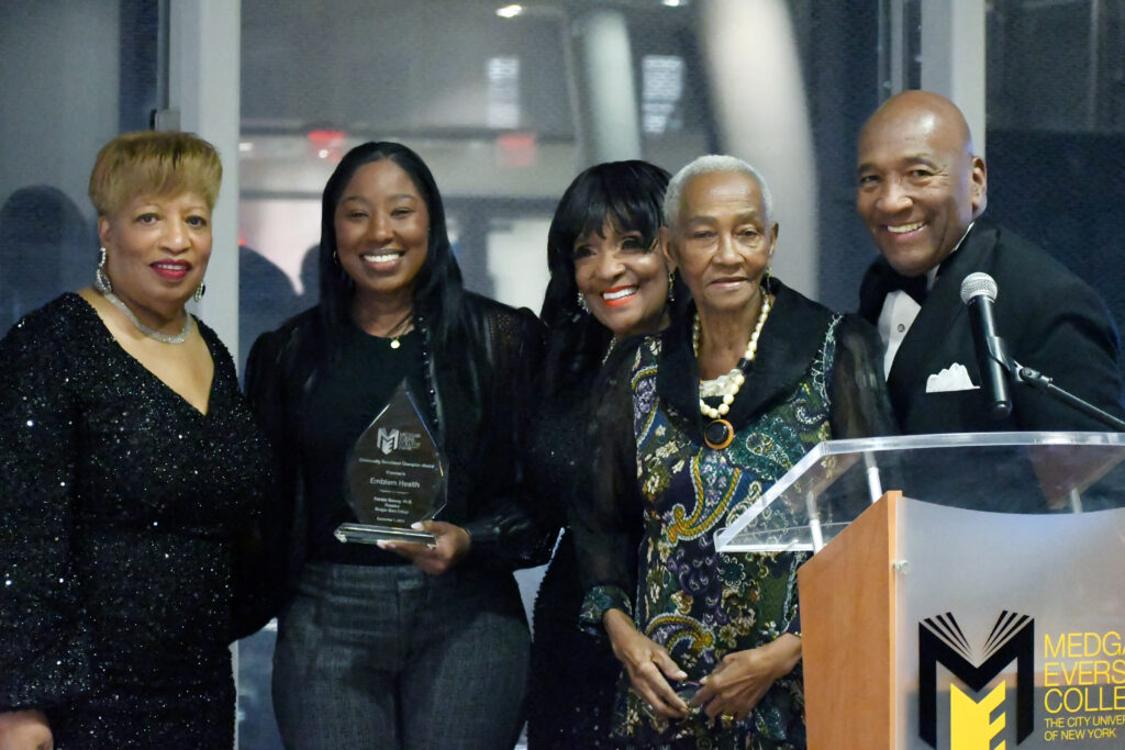 EmblemHealth’s George Hulse (far right) accepting the Community Investment Champion Award joined by (from left) Dr. Patricia Ramsey, Ann Marie Adamson-Serieux, Dr. Evelyn Castro and the Honorable Una S.T. Clarke
