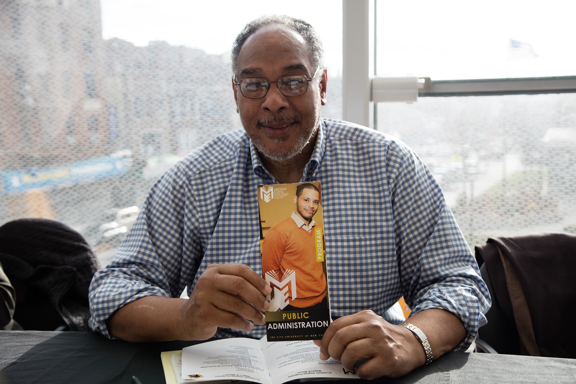 John Flateau holding book