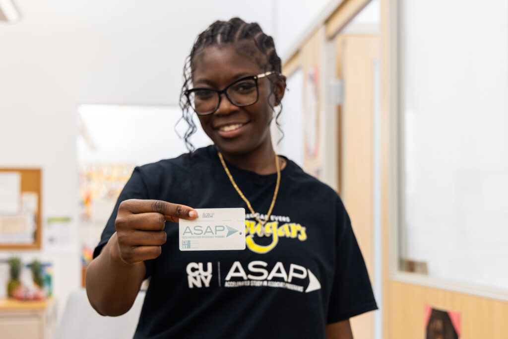 ASAP female student holding metrocard