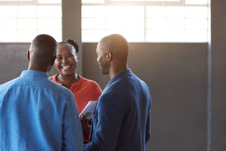 Three Casually Dressed Young African Work Colleagues Smiling 