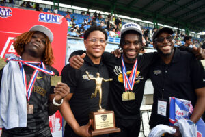All smiles as the men's team brings home all the hardware from the CUNYAC Championships on May 3, 2025. (Nick Masuda/Office of Communications)