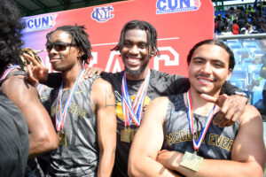 Gold-medal winners — Dontay Washington, Reco Griffith and Michael Ortega — are all smiles during the CUNYAC Championships award ceremony at Icahn Stadium on May 3, 2025. (Nick Masuda/Office of Communications)