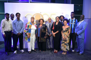 The contingent from Medgar Evers College takes a photo with Reena Evers-Everette (center) at the Jackson Convention Center. 