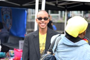 James Viafara greets students, faculty and staff as he represented the Medgar Evers College chapter of the NAACP at Club Fair. (Nick Masuda/Office of Communications)