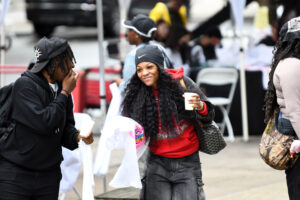 Plenty of students took to Crown Street despite the drizzly weather, laughing it up and taking advantage of a number of booths that were handing out shirts, food and swag. (Nick Masuda/Office of Communications)