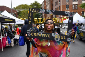 Senior Eternity Council enjoys a fun moment as she recruits members to Creative Soul, one of the many clubs on campus. (Fatima Ndiaye/Brooklyn Recovery Corps Intern, Office of Communications)