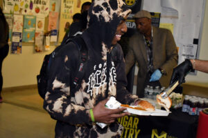 Students were enthusiastic about the hot vegetarian meal they were served by the World Food Movement. (Nick Masuda/Office of Communications)