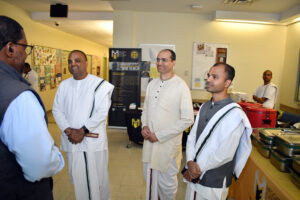 The leadership team at World Food Movement enjoy a conversation with Dr. Jesse Kane, the Senior Vice President of Student Success and Enrollment Management at Medgar Evers College. (Nick Masuda/Office of Communications)