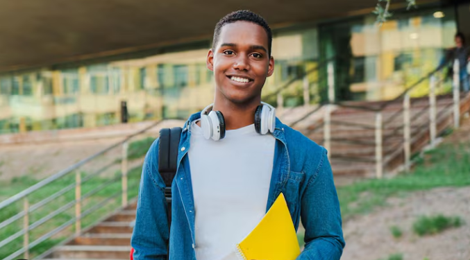 african american male student with yellow folder
