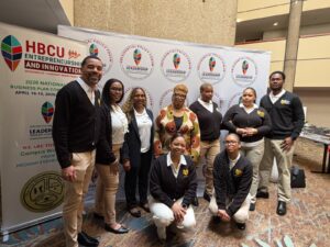 Standing left to right: Adjunct Professors Keith Kinch, Nakeba Mckoy, Dr. Zulema Blair (Dean), Dr. Patricia Ramsey (President), Vermita Adolphus (student), Aisha Dyer (student), Thierno Diallo (student). Front row: Adjunct Professor Lashawn Alexander and Zelena McDonald (student).